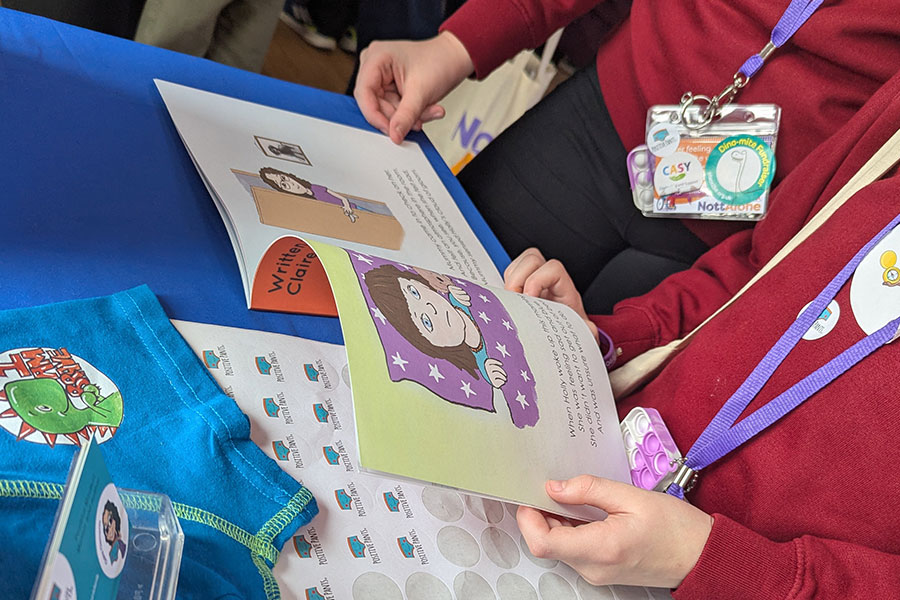 Two children reading the Positive Pants book.